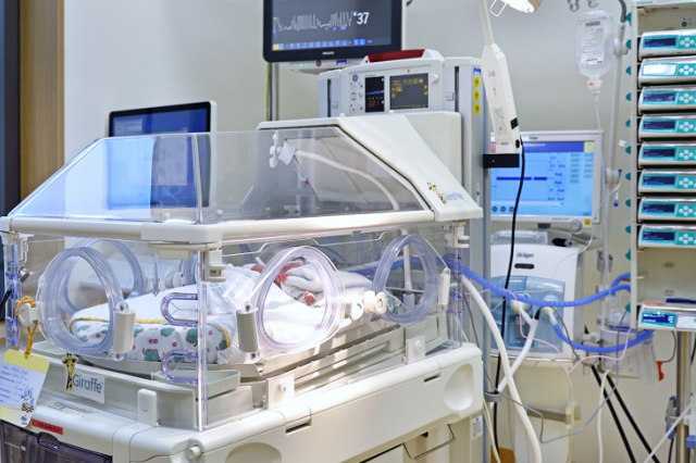 View in incubator with infant in clinic room